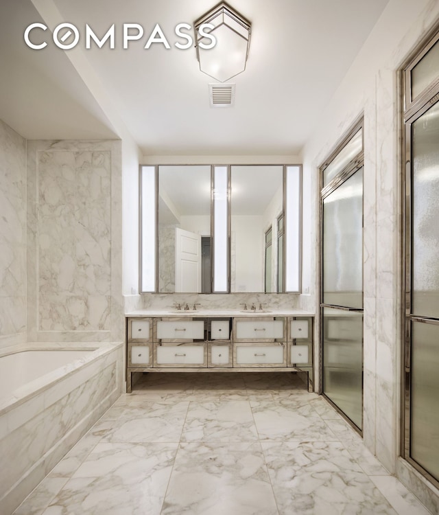 20 E End Ave Unit 4C, New York City, NY 10028 - bathroom featuring double vanity, a bath, and marble finish floors