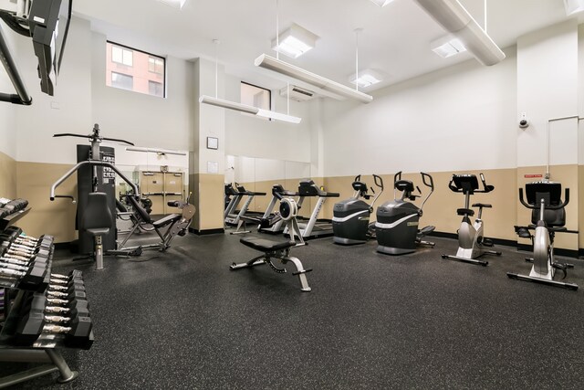 280 Rector Pl Unit 8H, New York City, NY 10280 - workout area featuring a high ceiling