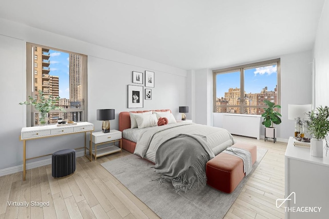 bedroom with light hardwood / wood-style floors