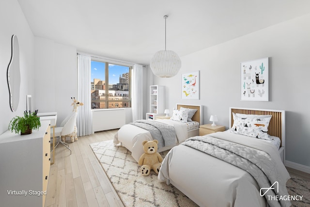 bedroom featuring wood finished floors