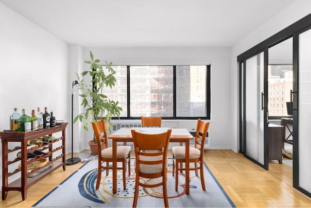 dining area with light parquet floors