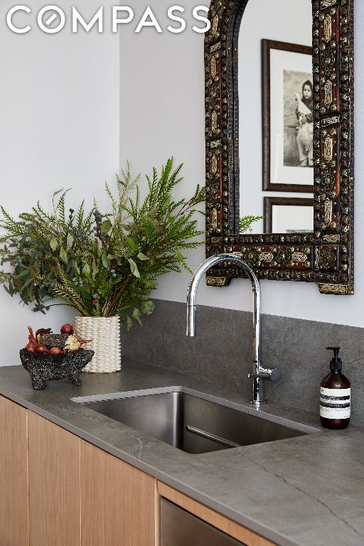 interior details featuring dark stone counters and sink