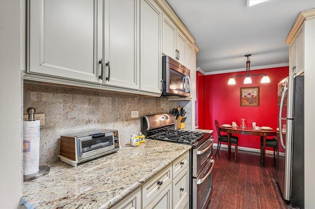 kitchen featuring hanging light fixtures, backsplash, stainless steel appliances, ornamental molding, and dark hardwood / wood-style flooring