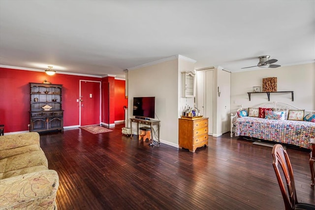 bedroom with crown molding, dark hardwood / wood-style floors, and ceiling fan