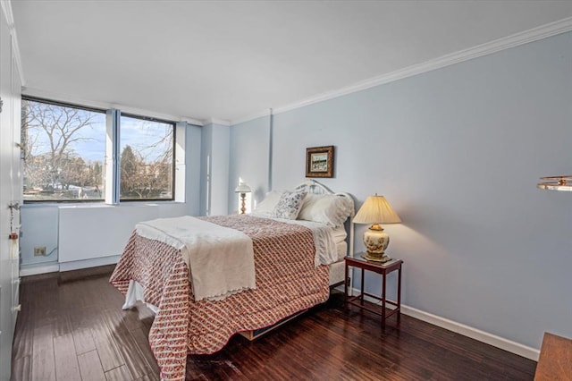 bedroom with ornamental molding and dark wood-type flooring