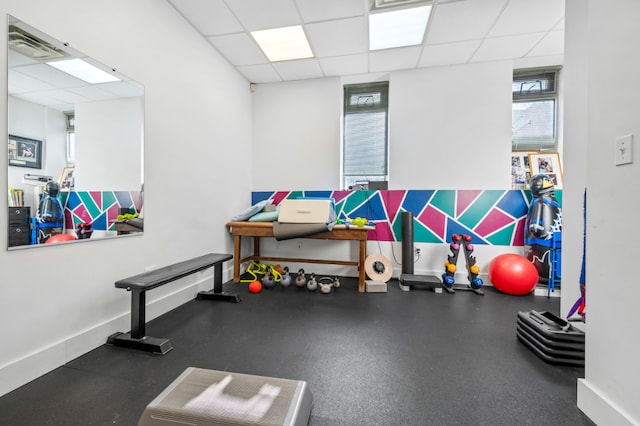 workout room with a drop ceiling