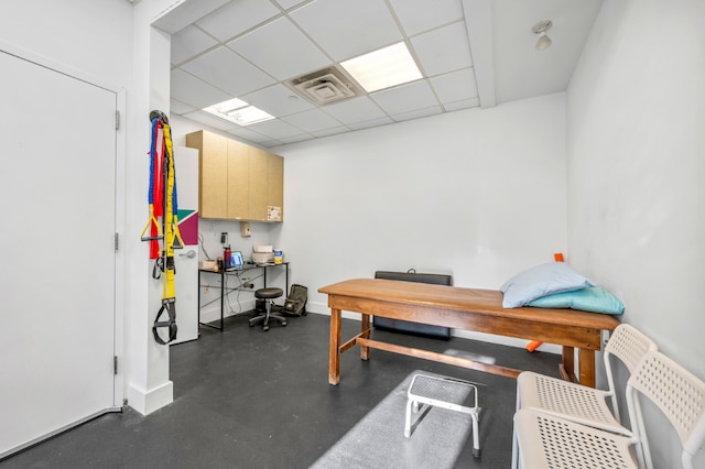 office with a paneled ceiling