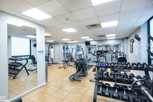 exercise room with a paneled ceiling