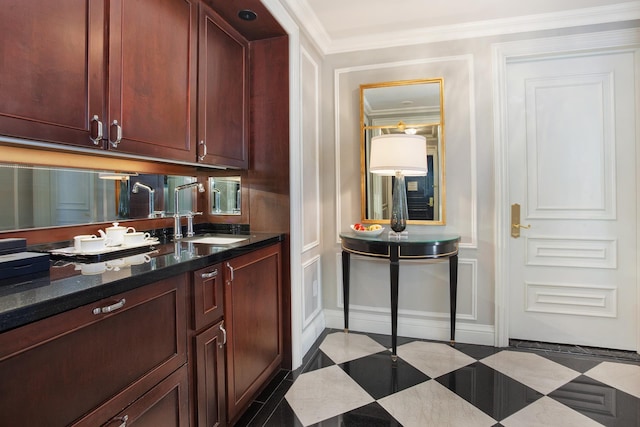 2 E 55th St Unit 901, New York City, NY 10022 - bar with dark stone countertops, sink, and crown molding