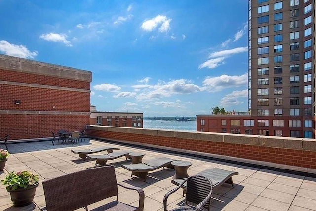 view of patio featuring a water view