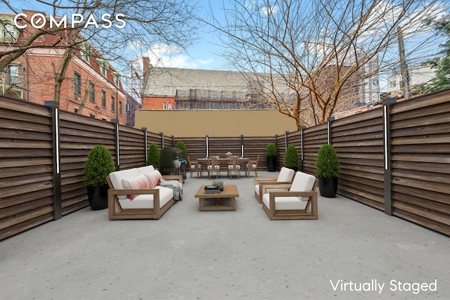 view of patio with a fenced backyard and an outdoor living space