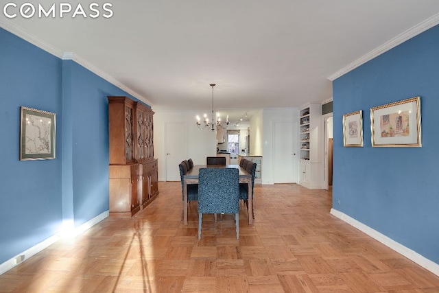 dining room featuring crown molding, light parquet flooring, built in features, and a notable chandelier