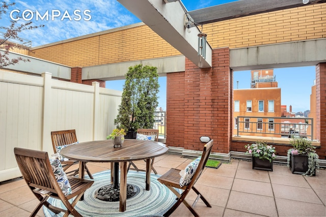 view of patio / terrace with fence and outdoor dining area