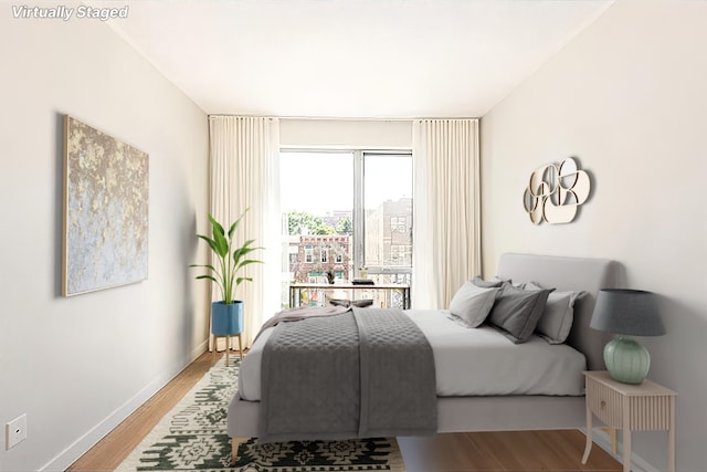 bedroom with light wood-type flooring