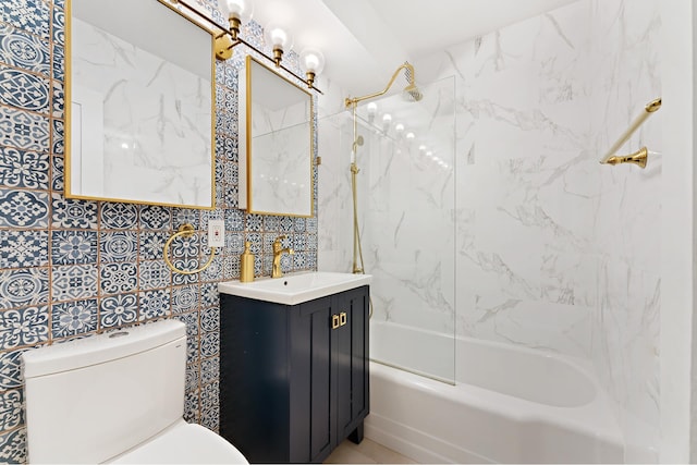 bathroom featuring toilet, shower / bath combination, and vanity