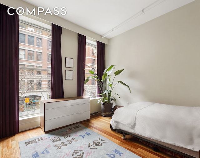 bedroom featuring light wood-style floors