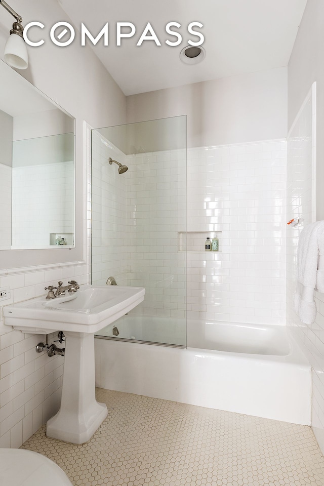 bathroom with shower / tub combination and toilet