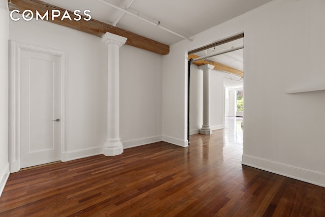 285 Lafayette St Unit 2B, New York City, NY 10012 - unfurnished room featuring wood finished floors, beamed ceiling, and decorative columns