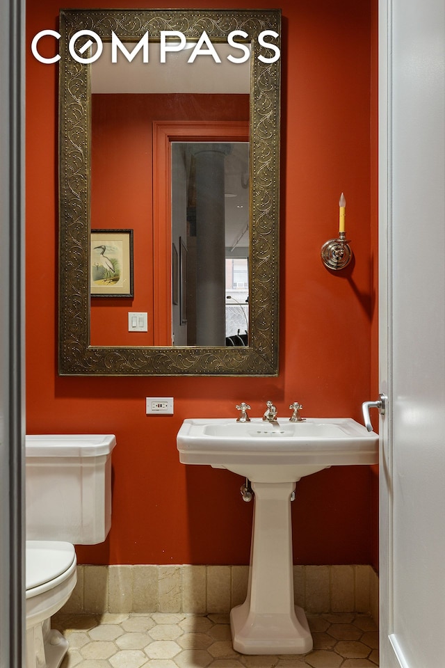 half bathroom with toilet