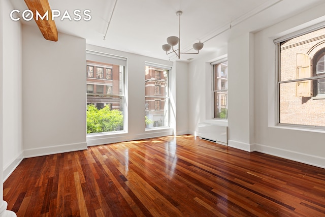 285 Lafayette St Unit 2B, New York City, NY 10012 - unfurnished dining area with hardwood / wood-style flooring and a chandelier