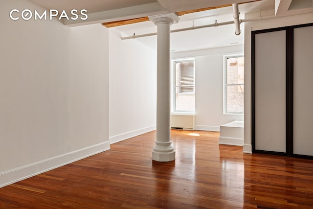 285 Lafayette St Unit 2B, New York City, NY 10012 - unfurnished room featuring decorative columns and wood finished floors