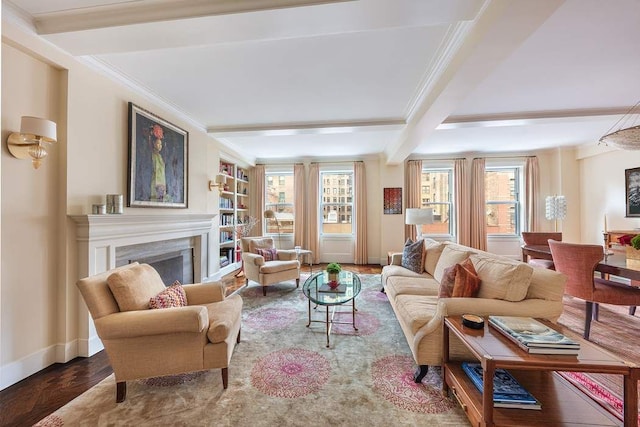 living room with crown molding, wood-type flooring, beam ceiling, and built in features