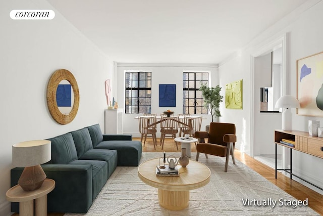 living room with crown molding and hardwood / wood-style flooring