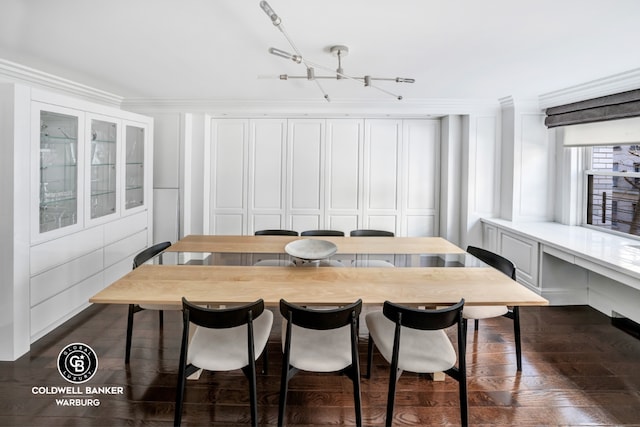 dining room with crown molding and dark hardwood / wood-style floors