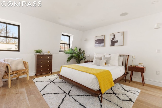 bedroom with light wood-type flooring