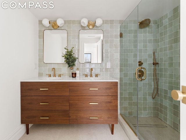 bathroom featuring tile patterned flooring, vanity, decorative backsplash, and walk in shower