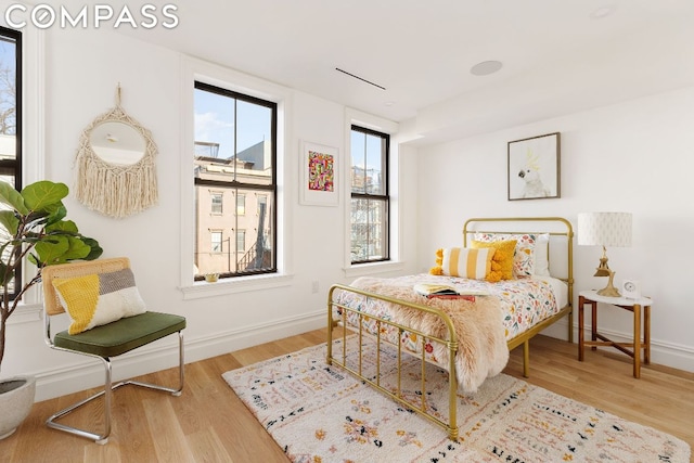 bedroom with light hardwood / wood-style floors