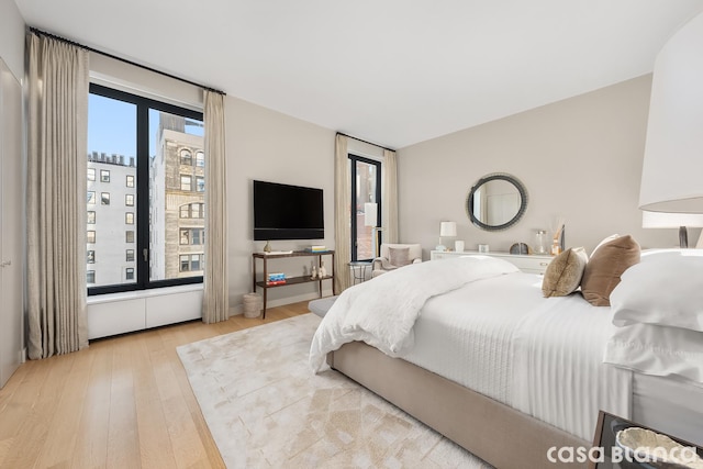 bedroom with light wood finished floors