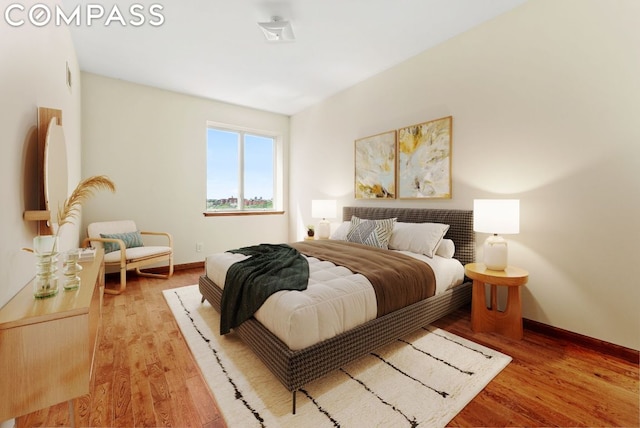 bedroom with light wood-type flooring