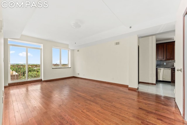 spare room with light wood-type flooring