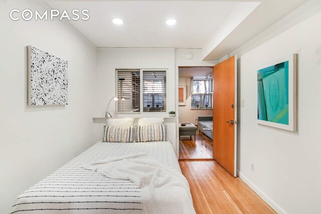 bedroom with light wood-type flooring