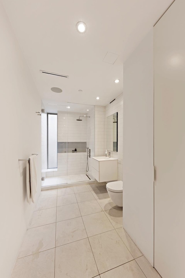 bathroom with tile patterned flooring, vanity, toilet, recessed lighting, and a stall shower