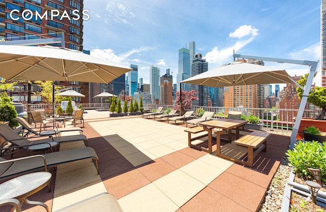 view of patio featuring a city view