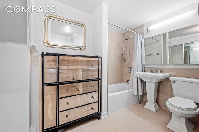 bathroom featuring shower / tub combo, toilet, and tile patterned flooring