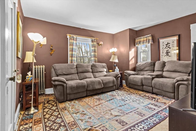 living area featuring radiator and baseboards