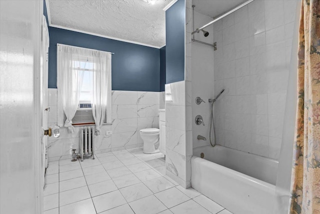 full bath with a textured ceiling, toilet, tile walls, radiator heating unit, and shower / bath combo with shower curtain