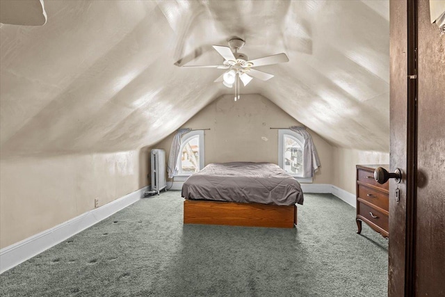 carpeted bedroom featuring a ceiling fan, vaulted ceiling, and baseboards
