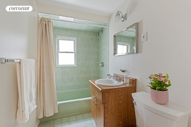 full bathroom featuring vanity, tile patterned floors, shower / bath combination with curtain, and toilet