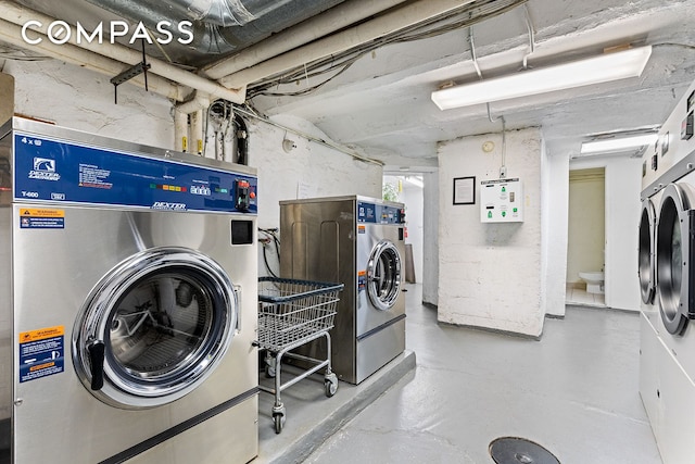 common laundry area featuring washing machine and clothes dryer