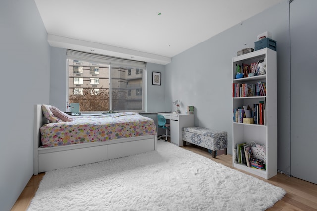 bedroom with wood finished floors