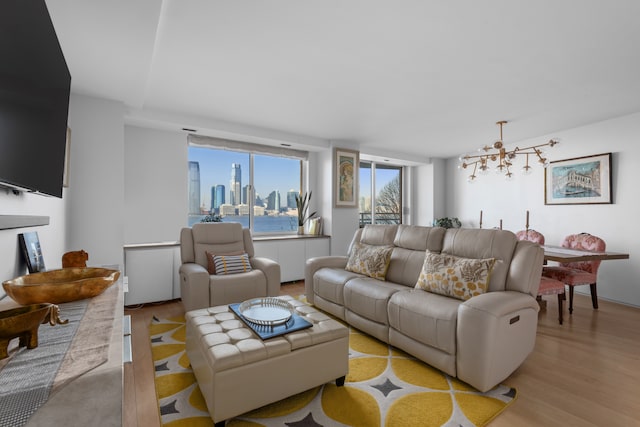 living room featuring a view of city and light wood-style floors