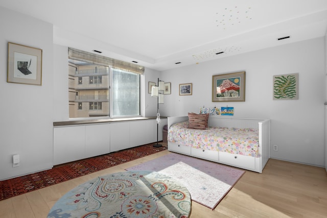 bedroom featuring wood finished floors