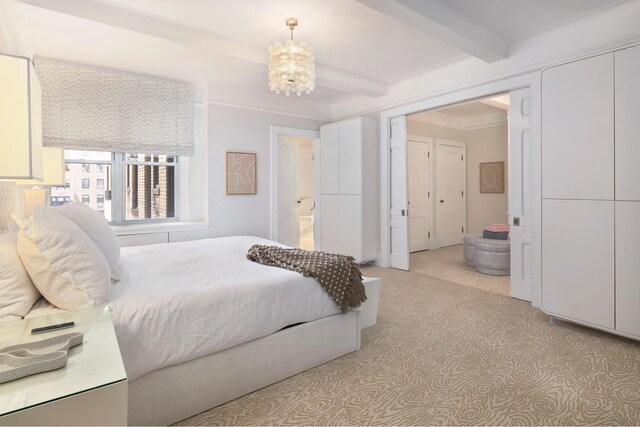 carpeted bedroom with crown molding, a notable chandelier, and beam ceiling