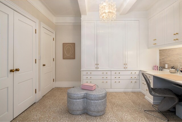 office featuring crown molding, beam ceiling, and a notable chandelier