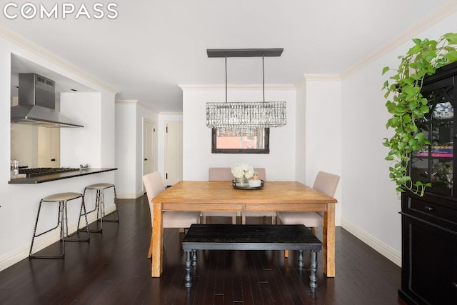 dining space with crown molding and dark wood-type flooring