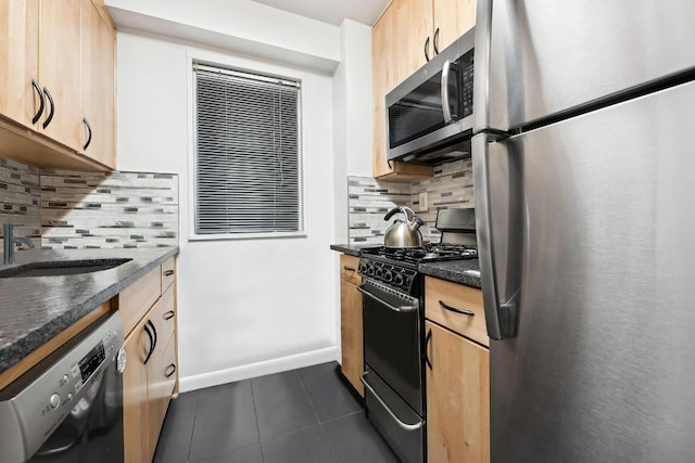 kitchen featuring sink, decorative backsplash, light brown cabinetry, and black appliances